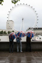 England, London, View across the River Thames during a rainy day toward the London Eye on the Southbank.