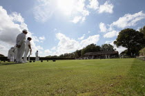 England, East Sussex, Uckfield, People playing flat lawn bowls at local club.