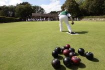 England, East Sussex, Uckfield, People playing flat lawn bowls at local club.