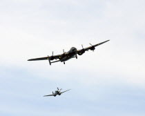 England, East Sussex, Beachy Head, Lancaster Bomber and Spitfire taking part in the Airbourne air show.