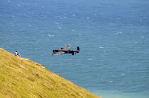 England, East Sussex, Beachy Head, Lancaster bomber taking part in the Airbourne air show.
