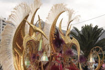 Spain, Canary Islands, Tenerife, Santa Cruz Latin carnival Golden pterodactyls float.