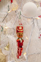 Religion, Festival, Christmas, Detail of tree decorated with lights, tinsel and various baubles.