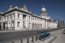 Ireland, Dublin, The Custom House with some Dublin bikes for hire. 
