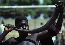 Kenya, Music, Man using horn as musical instrument