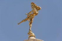 England, London, Golden statue of Shakespeares Ariel on a dome of the Bank of England.