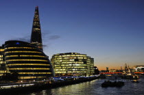 England, London, Southwark, River Thames with The Shard and City Hall at night.