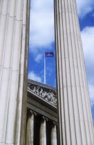 England, London, Classical Greek Style Portico of the British Museum seen through two columns.