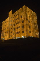 Bangladesh, Dhaka, Gulshan, Apartment block at night lit up for a wedding with strings of fairy lights cascading over the side.
