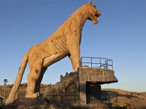 Peru, Stone statue of a Puma overlooking the city of Puno and Lake Titicaca.