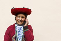 Peru, Young woman using a Cell Phone.
