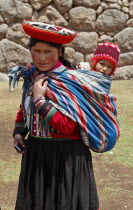 Peru, Woman with baby in traditional dress.