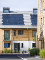 Architecture, Alternative Energy, Electricity, Solar photovoltaic roof tiles or slates on new houses by Linden Homes in Graylingwell Park.