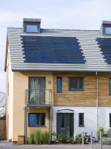 Architecture, Alternative Energy, Electricity, Solar photovoltaic roof tiles or slates on new houses by Linden Homes in Graylingwell Park.