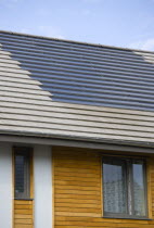 Architecture, Alternative Energy, Electricity, Solar photovoltaic roof tiles or slates on new houses by Linden Homes in Graylingwell Park.