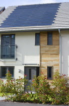 Architecture, Alternative Energy, Electricity, Solar photovoltaic roof tiles or slates on new houses by Linden Homes in Graylingwell Park.