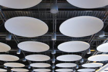 England, London, Heathrow Airport Terminal 5 disc ceiling in departures area.