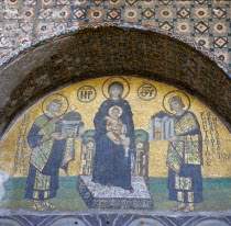 Turkey, Istanbul, Sultanahmet, Haghia Sophia Mosaic of The Virgin Mary holding the Infant Jesus flanked by Emperors Constantine and Justinian above the doorway reserved for the Emperor.