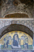 Turkey, Istanbul, Sultanahmet, Haghia Sophia Mosaic of The Virgin Mary holding the Infant Jesus flanked by Emperors Constantine and Justinian above the doorway reserved for the Emperor.