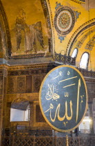 Turkey, Istanbul, Sultanahmet, Haghia Sophia Christian murals and Muslim iconography in calligraphic roundels together in the domed interior.