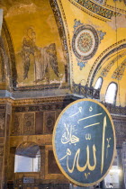 Turkey, Istanbul, Sultanahmet, Haghia Sophia Christian murals and Muslim iconography in calligraphic roundels together in the domed interior.
