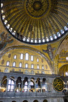 Turkey, Istanbul, Sultanahmet, Haghia Sophia Christian murals and Muslim iconography in calligraphic roundels together in the domed interior.