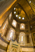 Turkey, Istanbul, Sultanahmet, Haghia Sophia Christian mosaic of Virgin Mary and Infant Jesus and Muslim Mihrab indicating the direction of Mecca in a niche at the end of the nave.