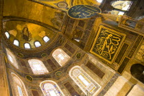 Turkey, Istanbul, Sultanahmet, Haghia Sophia Christian murals and Muslim iconography in calligraphic roundels together in the domed interior.