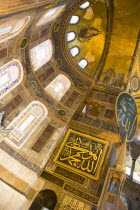 Turkey, Istanbul, Sultanahmet, Haghia Sophia Christian murals and Muslim iconography in calligraphic roundels together in the domed interior.