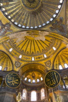 Turkey, Istanbul, Sultanahmet, Haghia Sophia Christian murals and Muslim iconography in calligraphic roundels together in the domed interior.