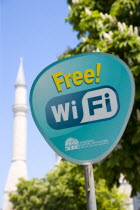 Turkey, Istanbul, Sultanahmet, Haghia Sophia minaret behind sign for Free Wifi hospot.