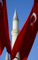 Turkey, Istanbul, Sultanahmet, Haghia Sophia minaret and Turkish red flag with white crescent moon and star.