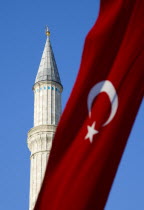 Turkey, Istanbul, Sultanahmet, Haghia Sophia minaret and Turkish red flag with white crescent moon and star.