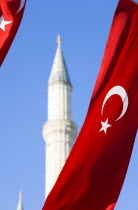 Turkey, Istanbul, Sultanahmet, Haghia Sophia minaret and Turkish red flag with white crescent moon and star.