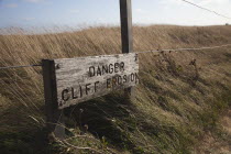 England, East Sussex, Beachy Head, Sign warning of cliff erosion.