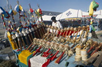 China, Tibet, Lhasa, Barkhor square, display of prayer wheels and flags for sale at a market.