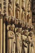 France, Ile de France, Paris, Notre Dame cathedral, detail of carvings around the entrance.