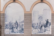 Spain, Extremadura, Badajoz, tiled arches on building in Paseo de San Francisco showing Alcazaba and Puerta de Palmas.