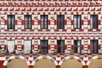 Spain, Extremadura, Badajoz, Colourfully painted exterior walls of building in Plaza Alta.