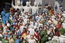 China, Shanghai, Porcelain figurines mainly of Chairman Mao Zedong but also of other Chinese communist leaders and Emperors and courtiers, Memorabilia on sale at Dongtai antique market.