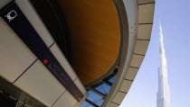 United Arab Emirates, Dubai, Metro station entrance in front of Burj Khalifa tower.