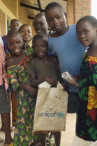 Burundi, Cibitoke Province, Buganda Commune. School Children at a development project one holding a UNICEF carrier bag, at Ruhembe Primary School.