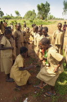 Burundi, Cibitoke Province, Buganda Commune, Ruhagurika Primary School girls dancing during their playtime outside Catch-Up Class in Buganda Commune. Catch up classes were established by Concern World...