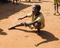 Burundi, Cibitoke Province, Buganda Commune, Ruhagurika Primary School boys playing marbles during their playtime outside Ruhagurika Catch-Up Class. Catch up classes were established by Concern Worldw...