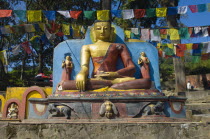 Nepal, Kathmandu, Buddha statue at the foot of the Swayambunath Monkey Temple.