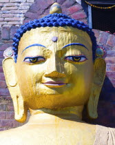 Nepal, Kathmandu, Beautiful golden Buddha head statue at theSwayambunath Monkey Temple.