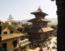 Nepal, Bhaktapur, Taumadhi Square, View through pillars of temple of goddess Siddhi Laxmi.