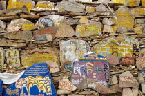 China, Szechuan Province, Litang county, Mani stone wall outside Litang Buddhist Monastery in Tibetan region.