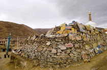 China, Szechuan Province, Litang county, Mani stone wall outside Litang Buddhist Monastery in Tibetan region.