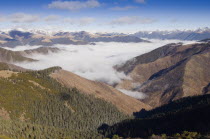 High altitude view across mountains and valleys in Tibetan region of Litang county, Szechuan Province, China.